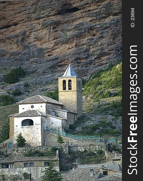 A romanesque church with the Mallos (Rocks) of Riglos behind. A romanesque church with the Mallos (Rocks) of Riglos behind.