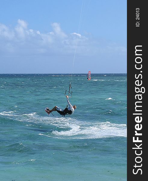 Parasailing man in action on a windy day
