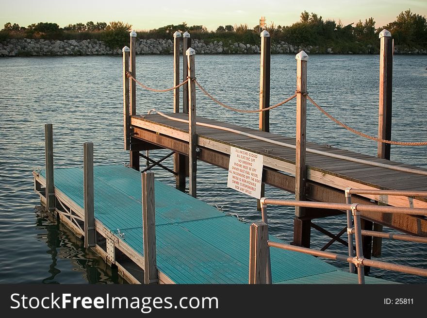 A 2 level dock area on Lake Erie with warning sign in view. Photographed in late evening sun. A 2 level dock area on Lake Erie with warning sign in view. Photographed in late evening sun