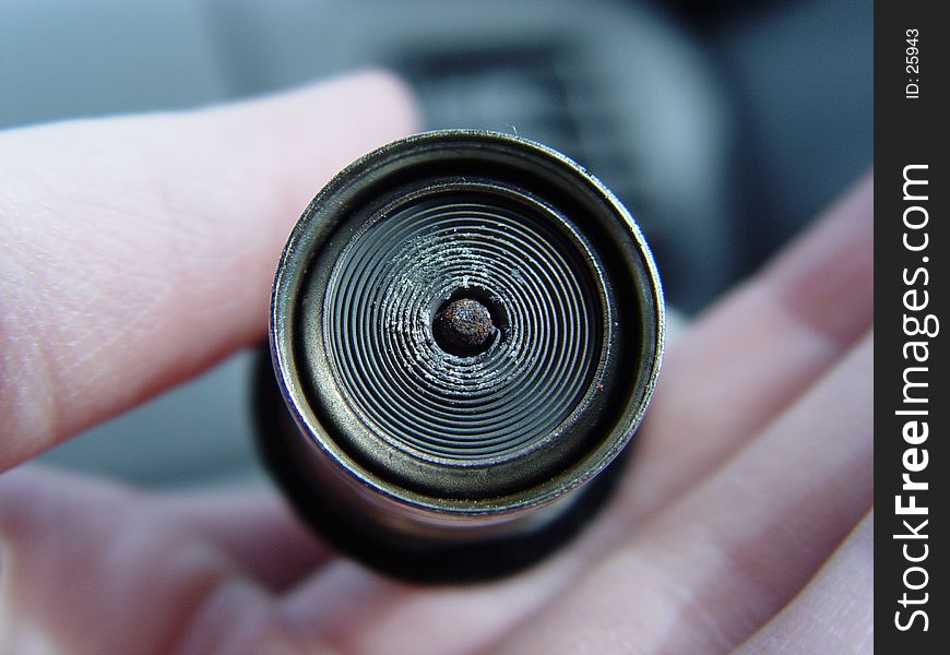 Female holding a car lighter, exposed, detailed