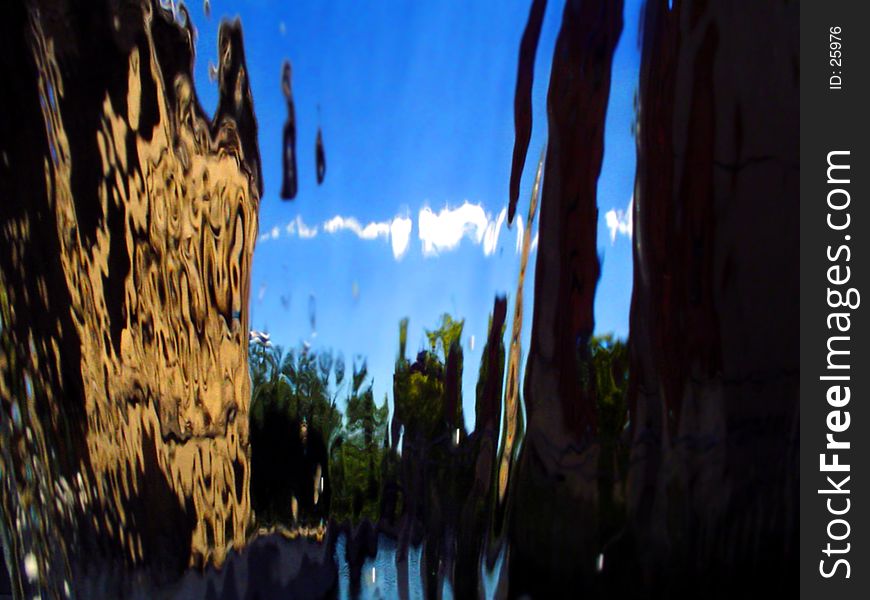 City scape defracted thru the falling water. City scape defracted thru the falling water