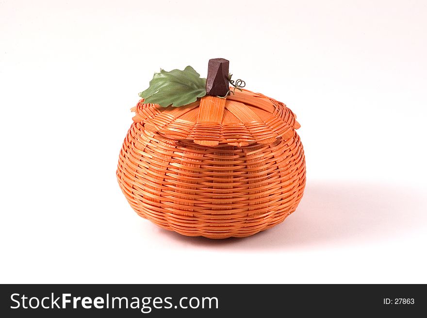 A small wicker pumpkin decoration for Halloween and Thanksgiving