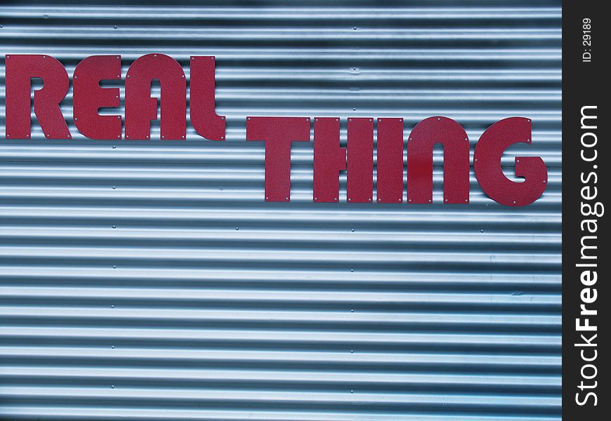 Real thing words on a blue wall (no logo!)