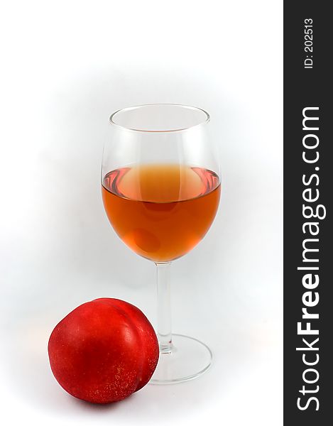 Glass of wine and nectarine. Glass of wine and nectarine
