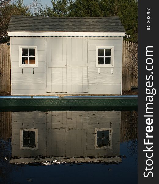 Reflection of a shed in a pool. Reflection of a shed in a pool.