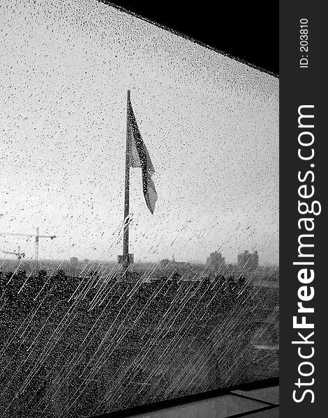German flag on the reichstag through rain on glass. German flag on the reichstag through rain on glass