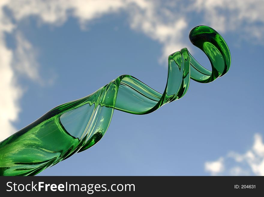 Curly Green Glass. It is actually a vase I found in a fancy fair. Very much love the shape of it. Photo was taken outside on a lovely sunny day - look at how the clouds seem to 'frame' this picture!