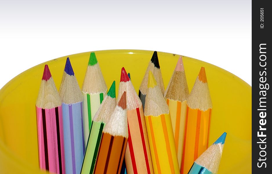 Color pencils in yellow container - closeup