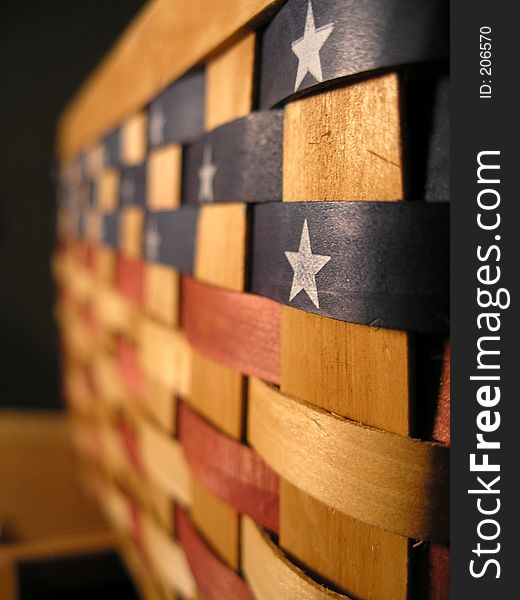 A wooden woven basket painted with America's colors. A wooden woven basket painted with America's colors.