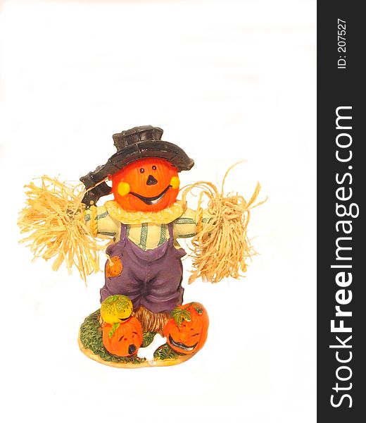A pumpkin scarecrow over white