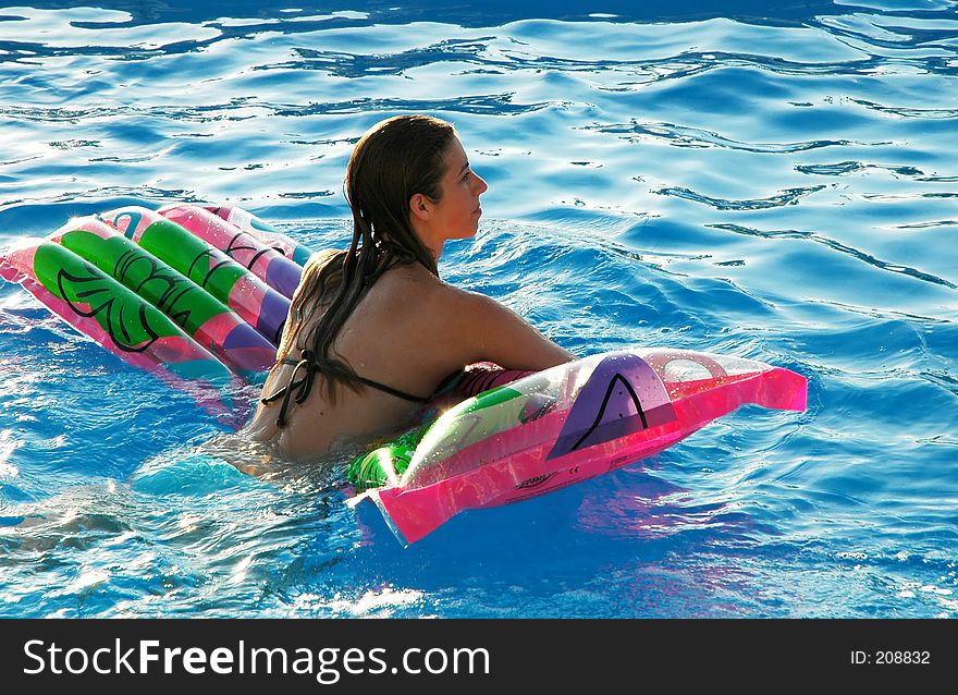 Young woman on pool mattress. Young woman on pool mattress