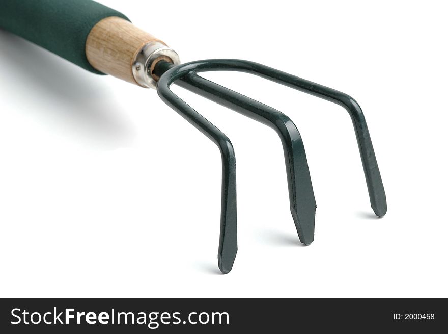 Green garden cultivator close-up on a white background.