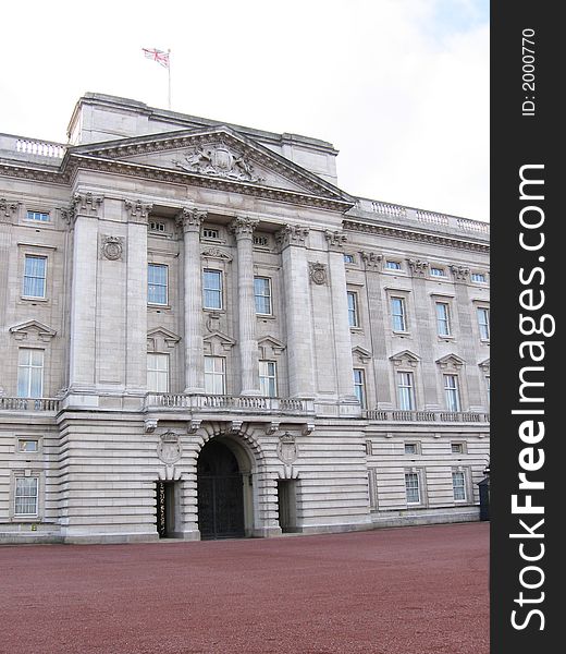 This image depicts the exterior of Buckingham Palace, London, England. The Queen is in residence.