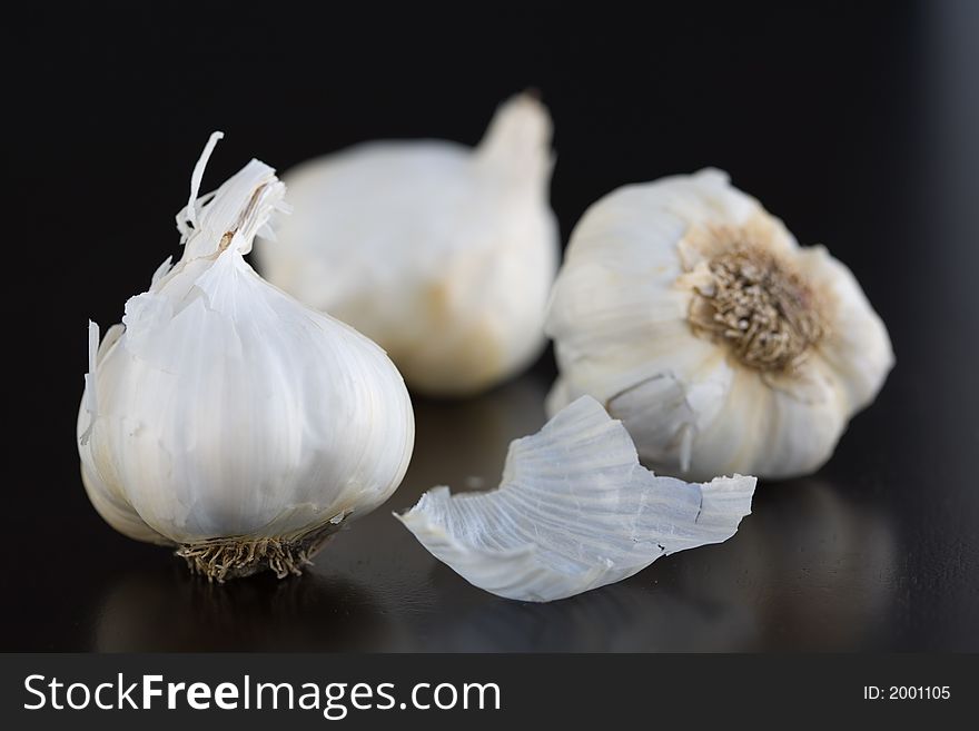 Fresh Garlic on a dark wooden table