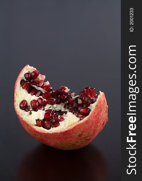 Pomegrantes ripped open with seeds exposed