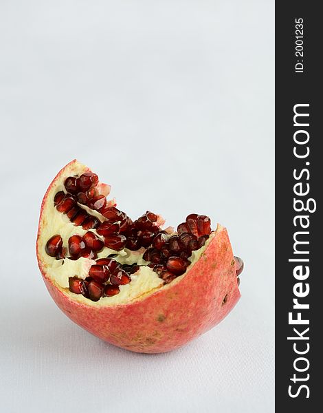 Pomegrantes ripped open with seeds exposed