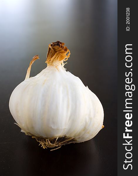 Bulbs of Roasted Garlic on a roasting pan fresh out of the oven. Bulbs of Roasted Garlic on a roasting pan fresh out of the oven