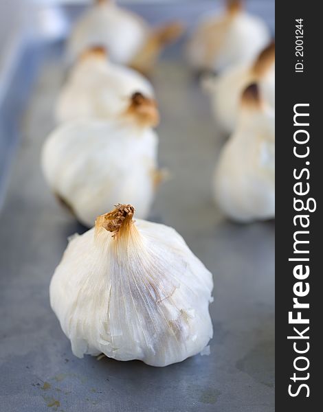 Garlic Bulbs Roasted On A Roasting Pan