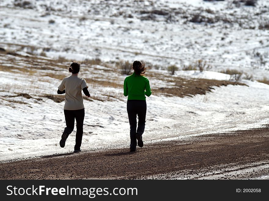 Girls Running Along Gravel Road in Wyoming. Girls Running Along Gravel Road in Wyoming