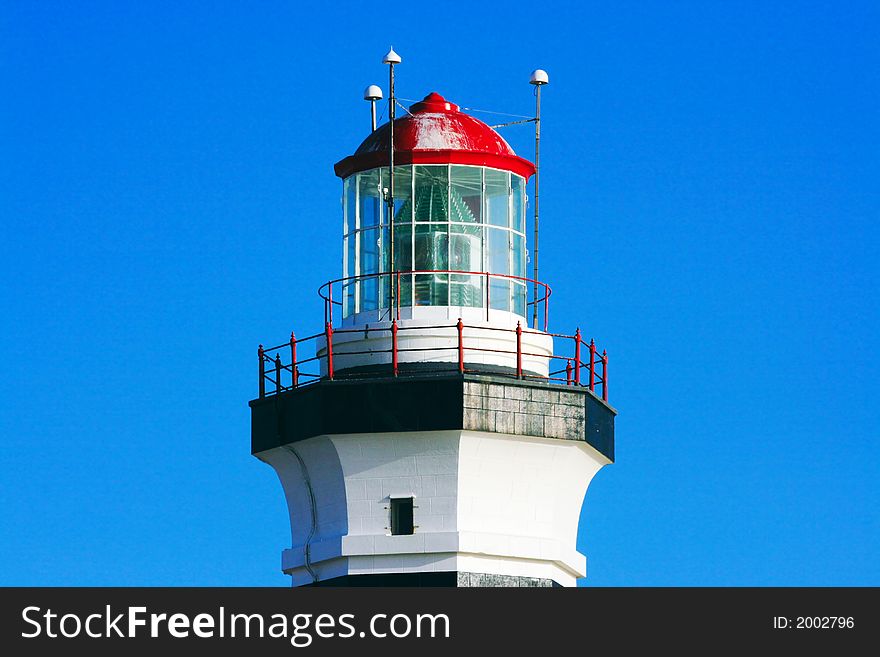 Top part of lighthouse on sunny day. Top part of lighthouse on sunny day