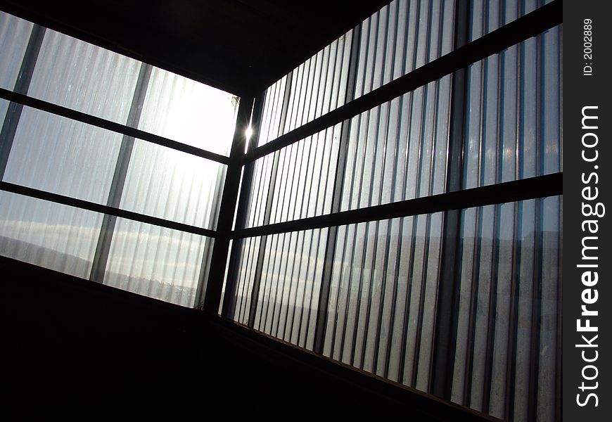 Sun shining through the windows of a building. Sun shining through the windows of a building