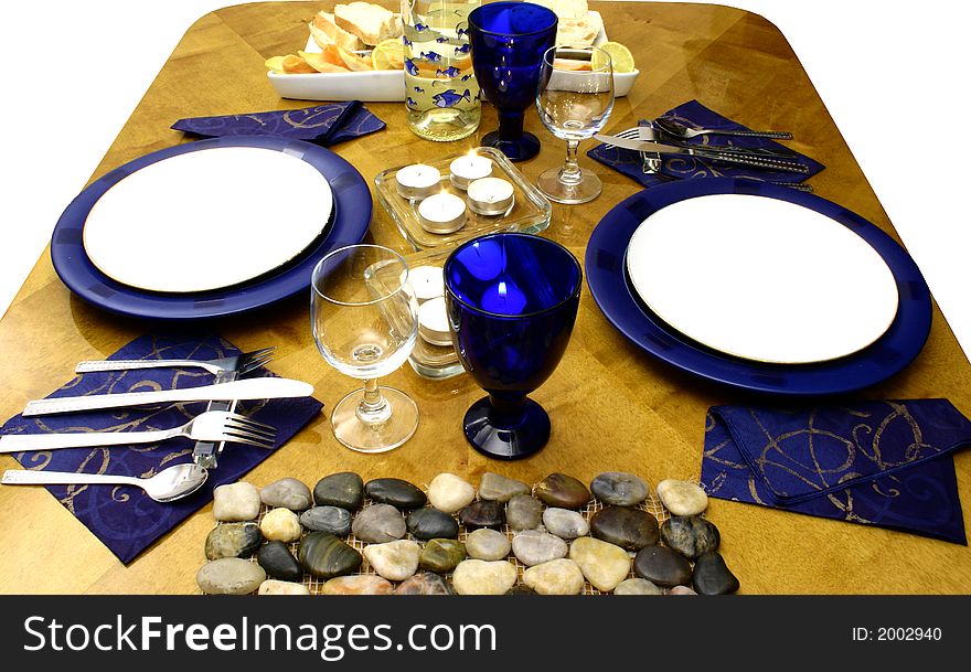 Wooden table with everything ready for occasional dinner (side view). Wooden table with everything ready for occasional dinner (side view)