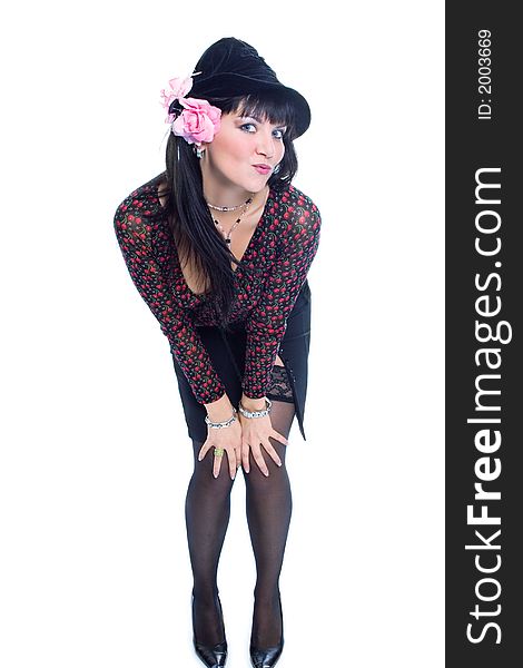 Beauty brunette girl in bonet with pink flower on white background