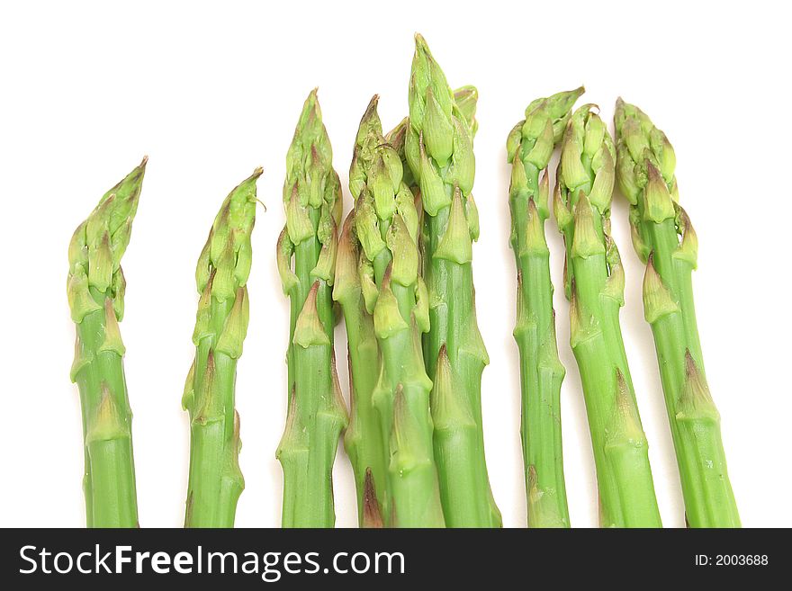 Shot of asparagus on top of white