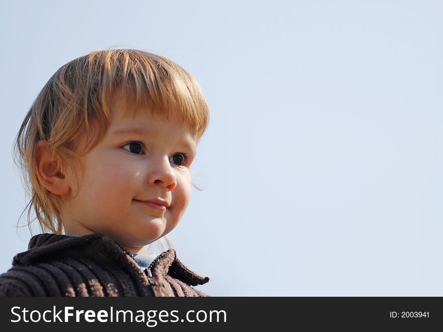 Child portrait with blue sky background. Child portrait with blue sky background