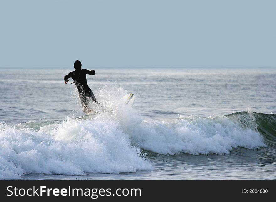 Surfer falling in the sea