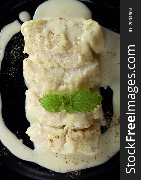 Delicious oven cod in creamy dressing with mint