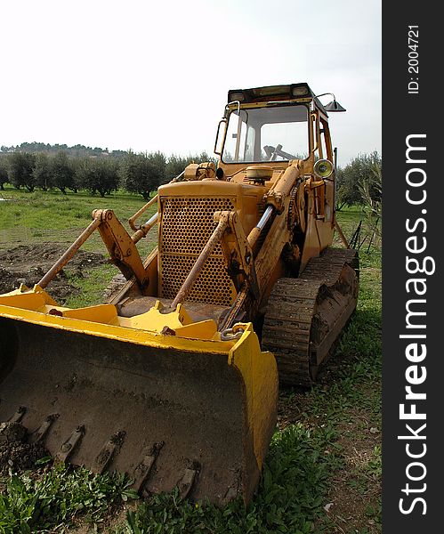 A yellow dozer unused for a long time