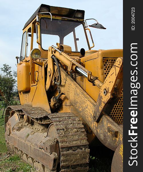 A yellow dozer unused for a long time