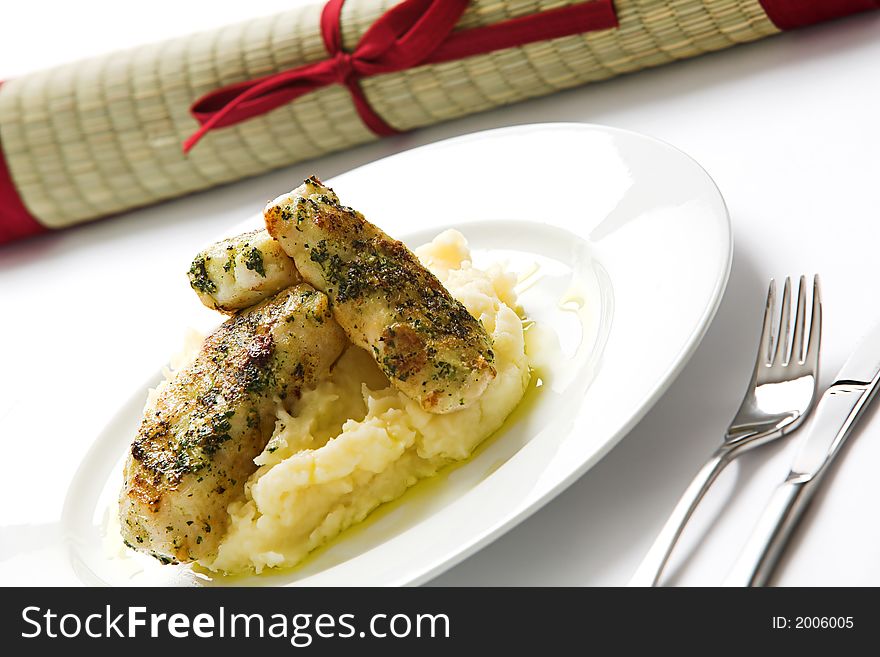 Basil topped fish over mash. Basil topped fish over mash