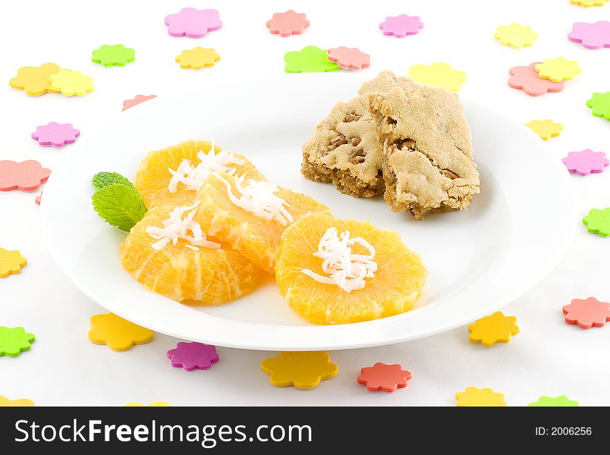 I scattered sponge dots over the table, then served orange slices topped with coconut and added butterscotch brownies,(Praline squares). I scattered sponge dots over the table, then served orange slices topped with coconut and added butterscotch brownies,(Praline squares).