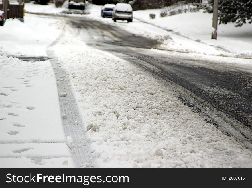 A busy road immediately after a wintry downpour. A busy road immediately after a wintry downpour