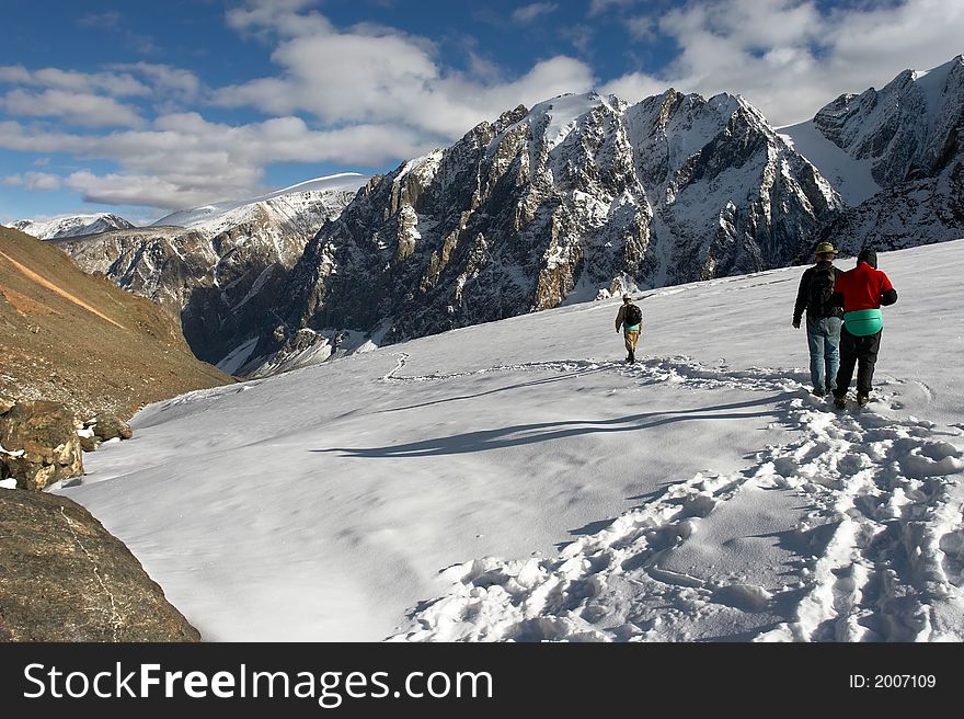 Men, mountains and glacier. Altay. Russia.