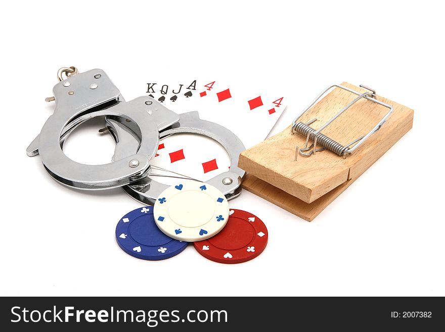 Illegal gamling, risk of being caught, cards, mouse trap, and handcuffs. Illegal gamling, risk of being caught, cards, mouse trap, and handcuffs
