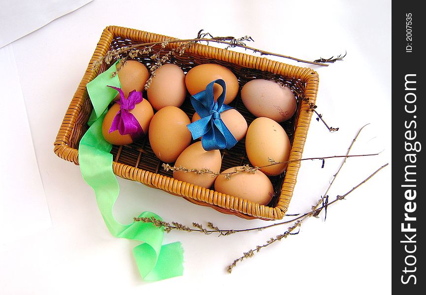 Basket box with eggs, object ower white, eggs with bows, herbs. Basket box with eggs, object ower white, eggs with bows, herbs