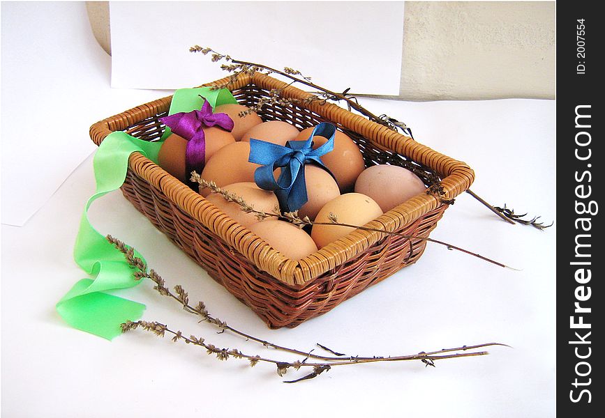 Basket Easter's eggs, object ower white, eggs with bows, herbs. Basket Easter's eggs, object ower white, eggs with bows, herbs