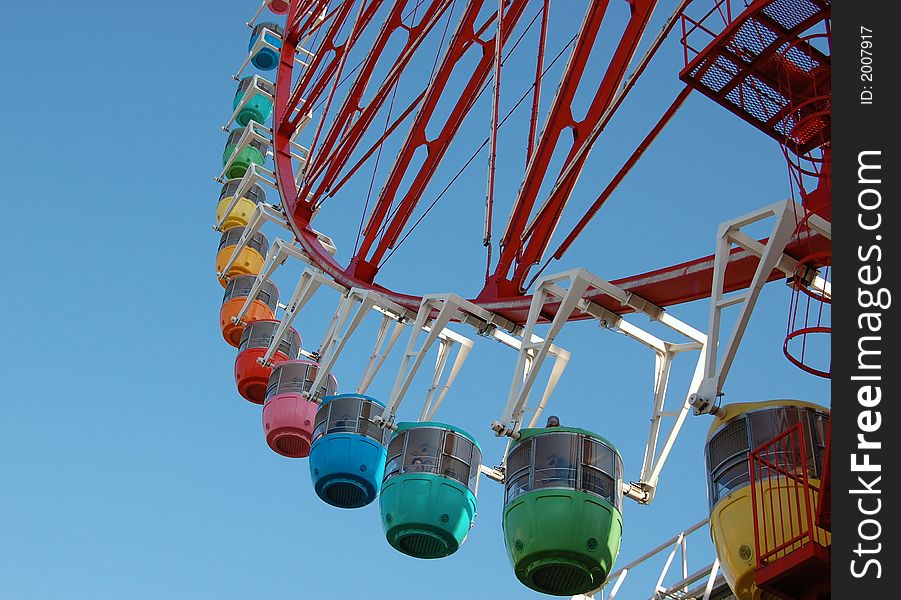 Colourful gondolas with blue sky as background