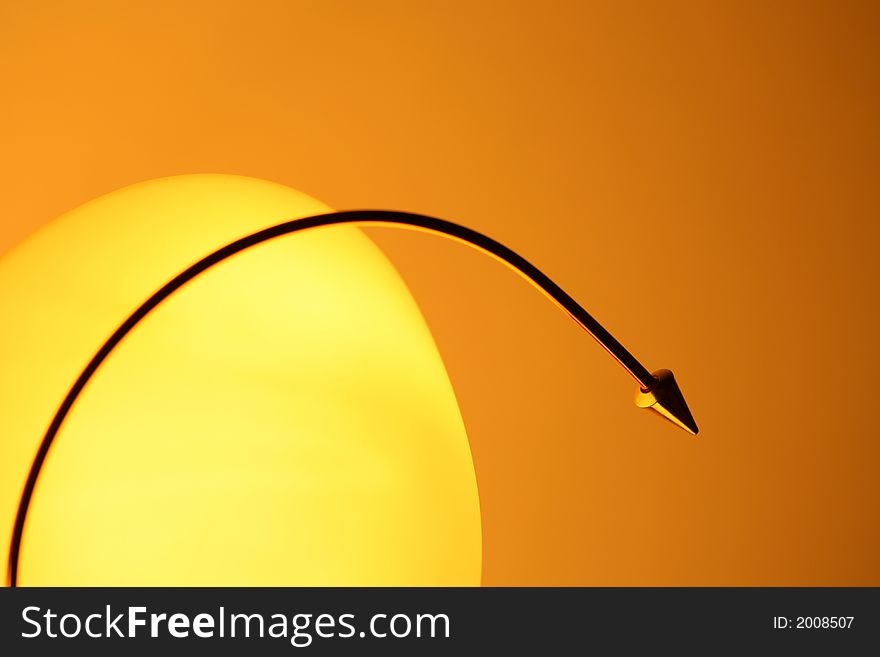 Yellow lamp-shade on orange background