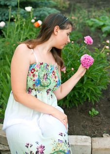 Girl Against Pink Peony Flowers Royalty Free Stock Photography Girl Against Pink Peony Flowers Royalty Free Stock Photography