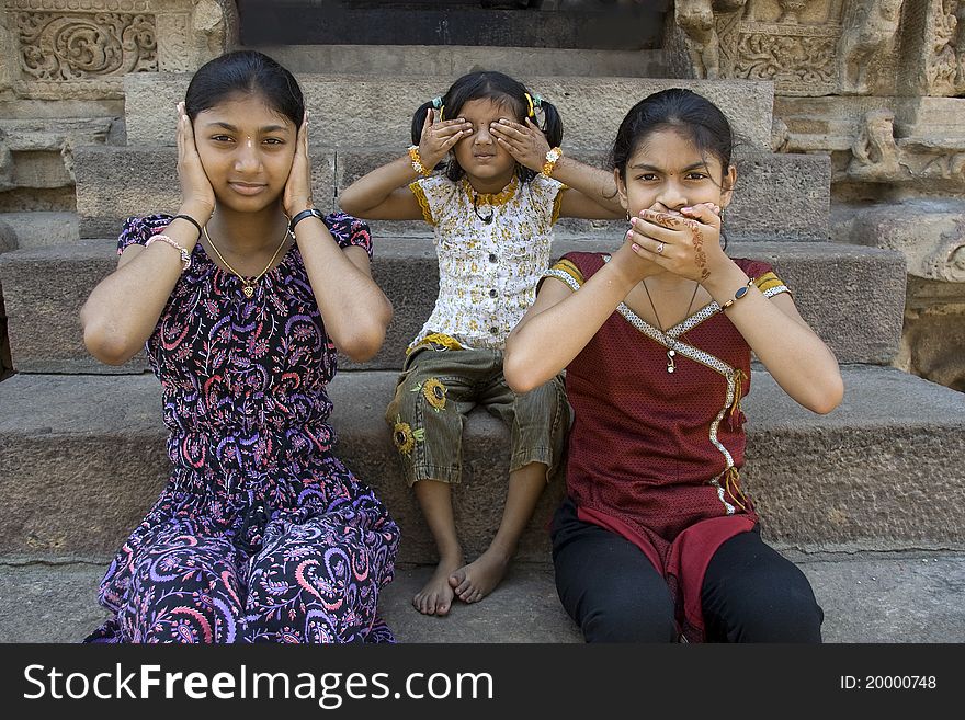 Girls enacting concept of Hear no evil, see no evil and speak no evil. Girls enacting concept of Hear no evil, see no evil and speak no evil