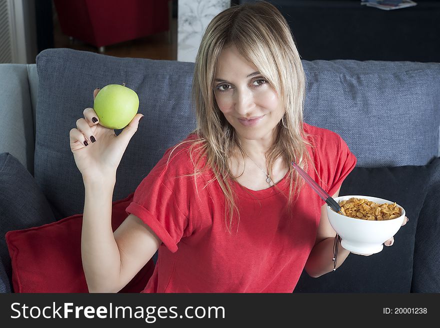 Beautiful blond woman having a healthy breakfast. Beautiful blond woman having a healthy breakfast