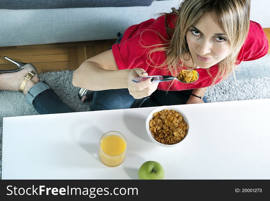 Beautiful blond woman having a healthy breakfast. Beautiful blond woman having a healthy breakfast