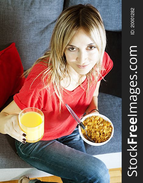 Beautiful blond woman having a healthy breakfast. Beautiful blond woman having a healthy breakfast