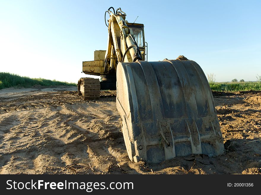 Digger, Heavy Duty construction equipment parked at work site