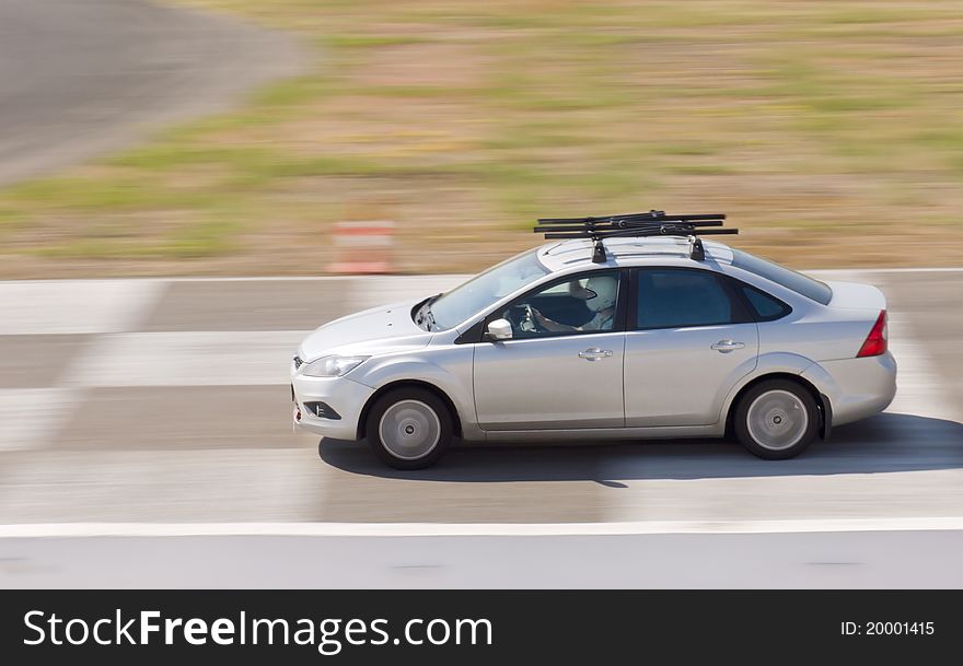 Fast grey car in a race. Fast grey car in a race