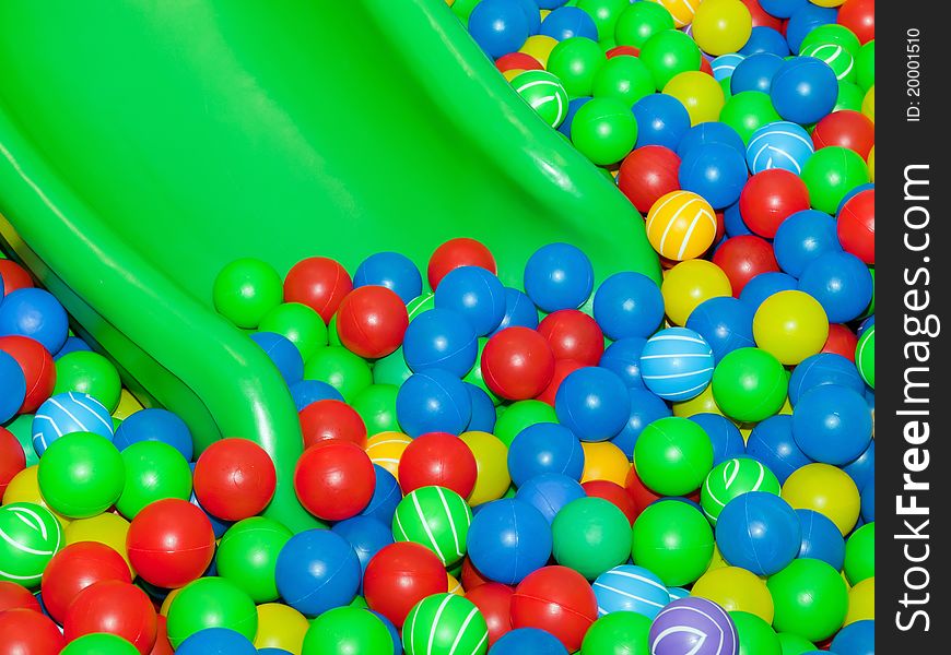 Playground slide and colorful plastic balls. Playground slide and colorful plastic balls